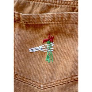 Skeleton flower embroidered tan jeans